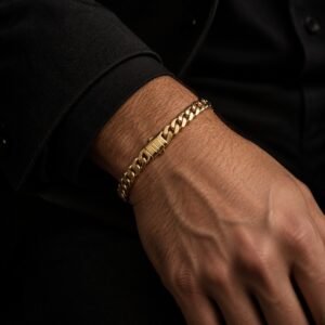 14K yellow gold Monaco Edge curb bracelet worn on a man's wrist