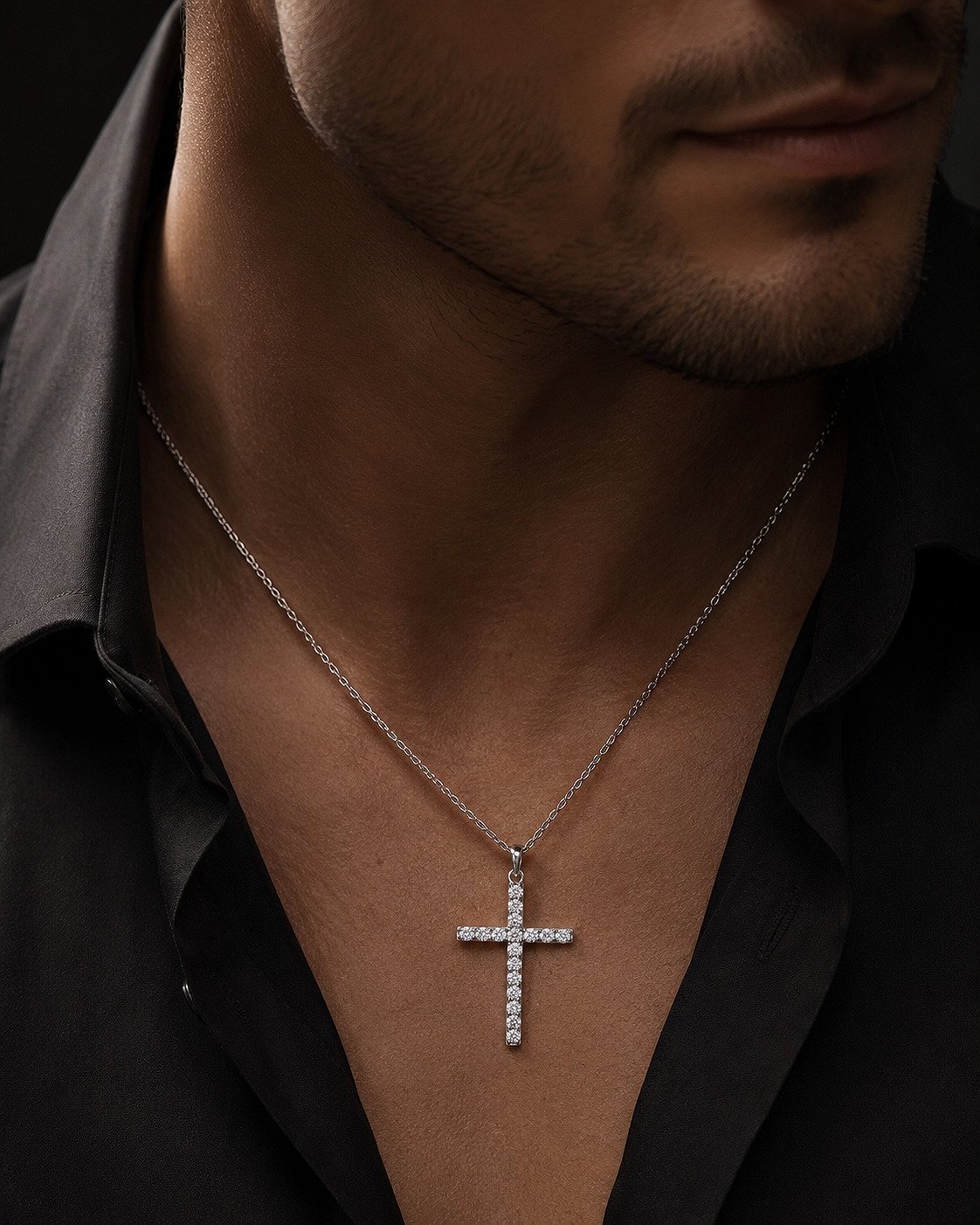 Close-up of a 14K white gold diamond cross pendant set with lab-grown diamonds on a male model.