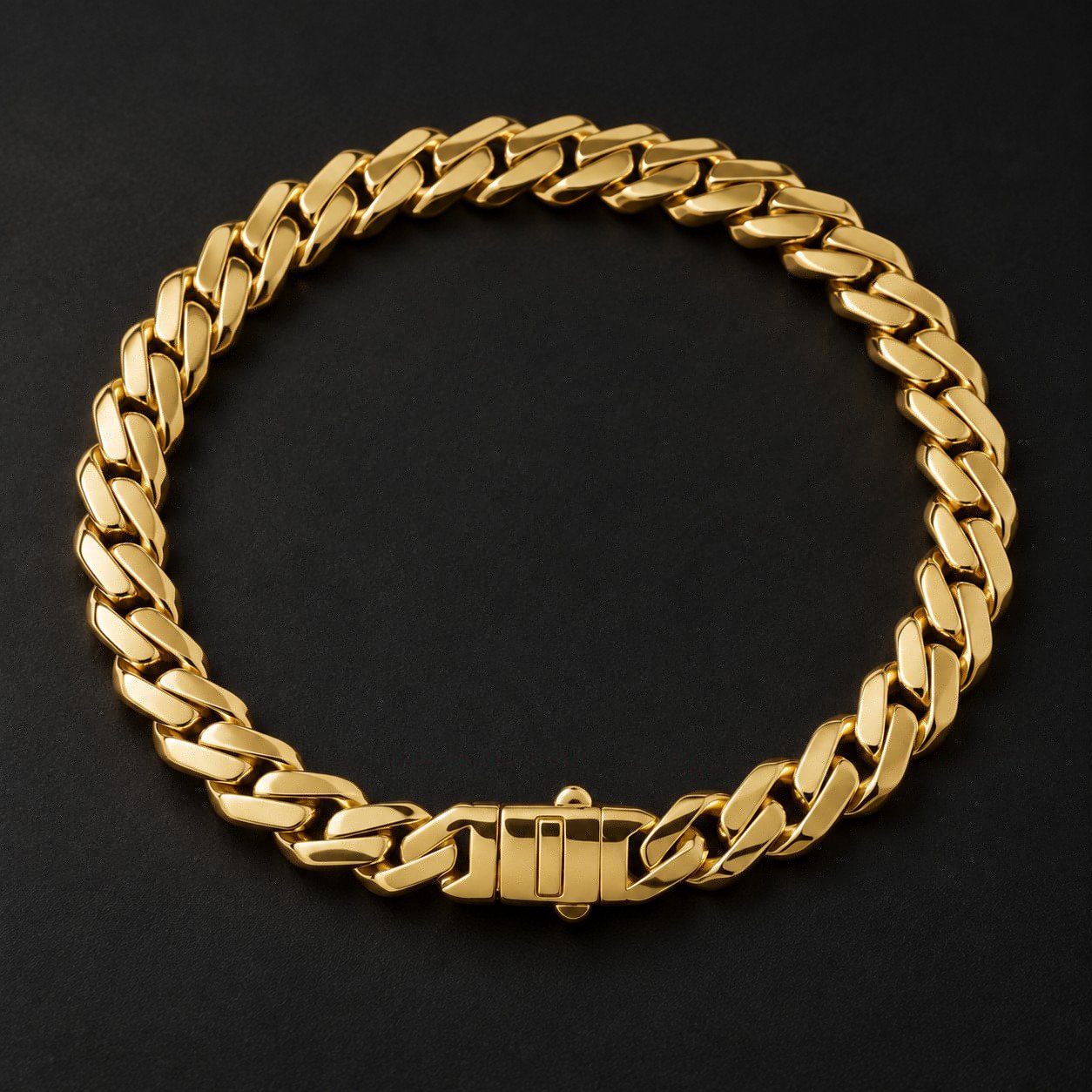 Complete 14K yellow gold 7.4 mm Monaco Edge curb bracelet on a dark studio background.